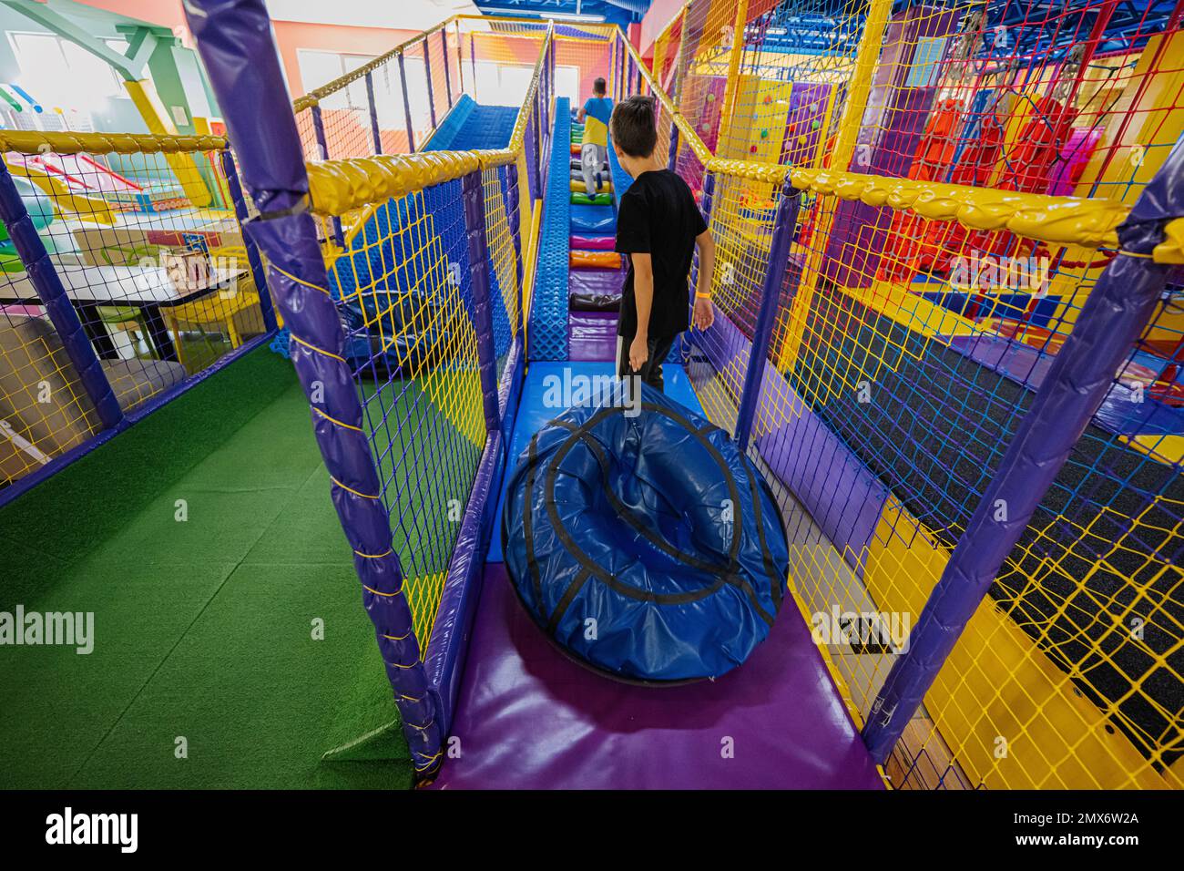 Kids playing at indoor play center playground in tubes Stock Photo Alamy