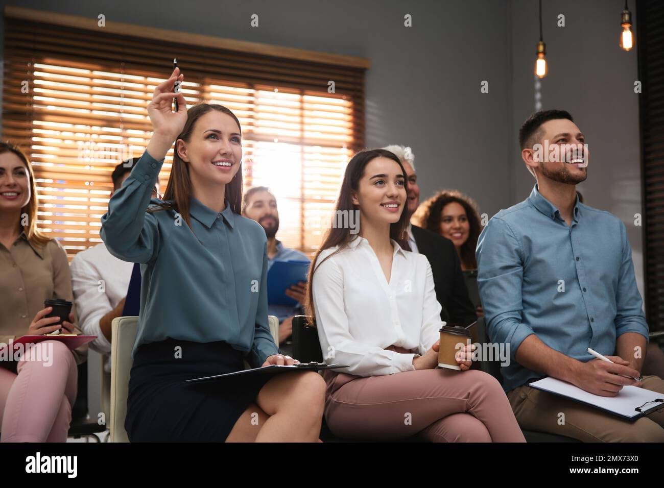 Senior woman raising hand hi-res stock photography and images - Alamy