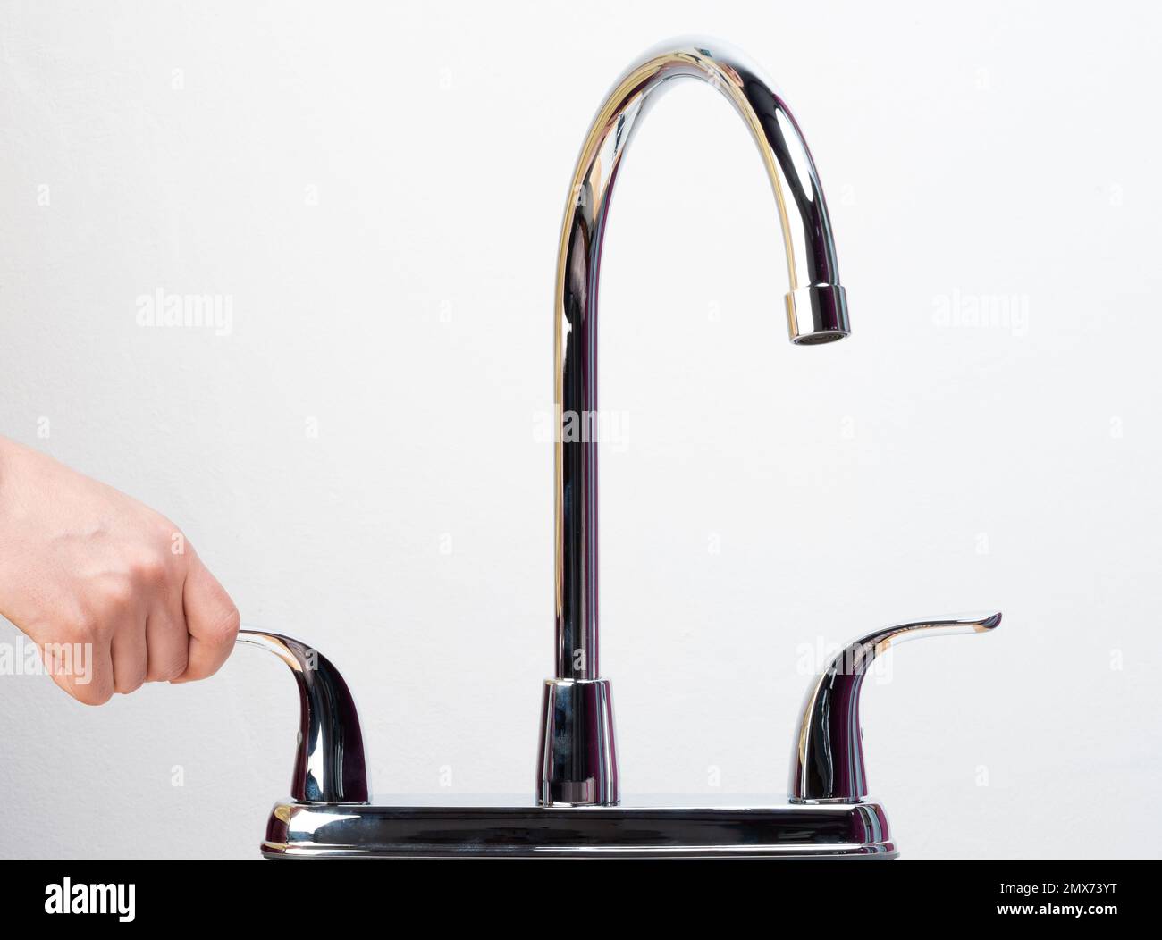 Shut kitchen faucet with moving handle mixer isolated Stock Photo