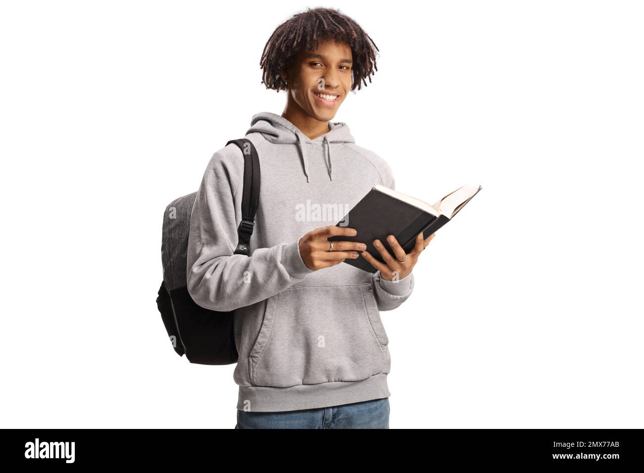 Male african american student standing and reading a book isolated on ...
