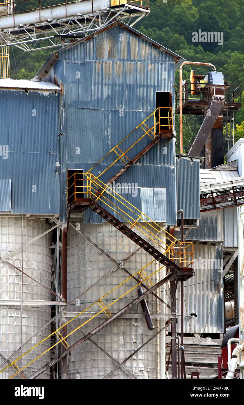 Metal stairs zig zag their way up the side of a factory in Tennessee ...