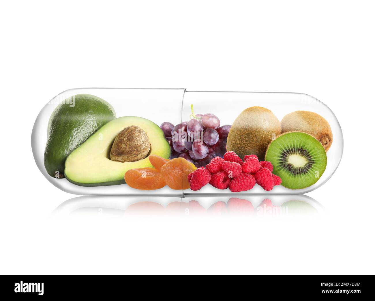 Transparent capsule with different fruits and berries rich in vitamins on white background Stock Photo