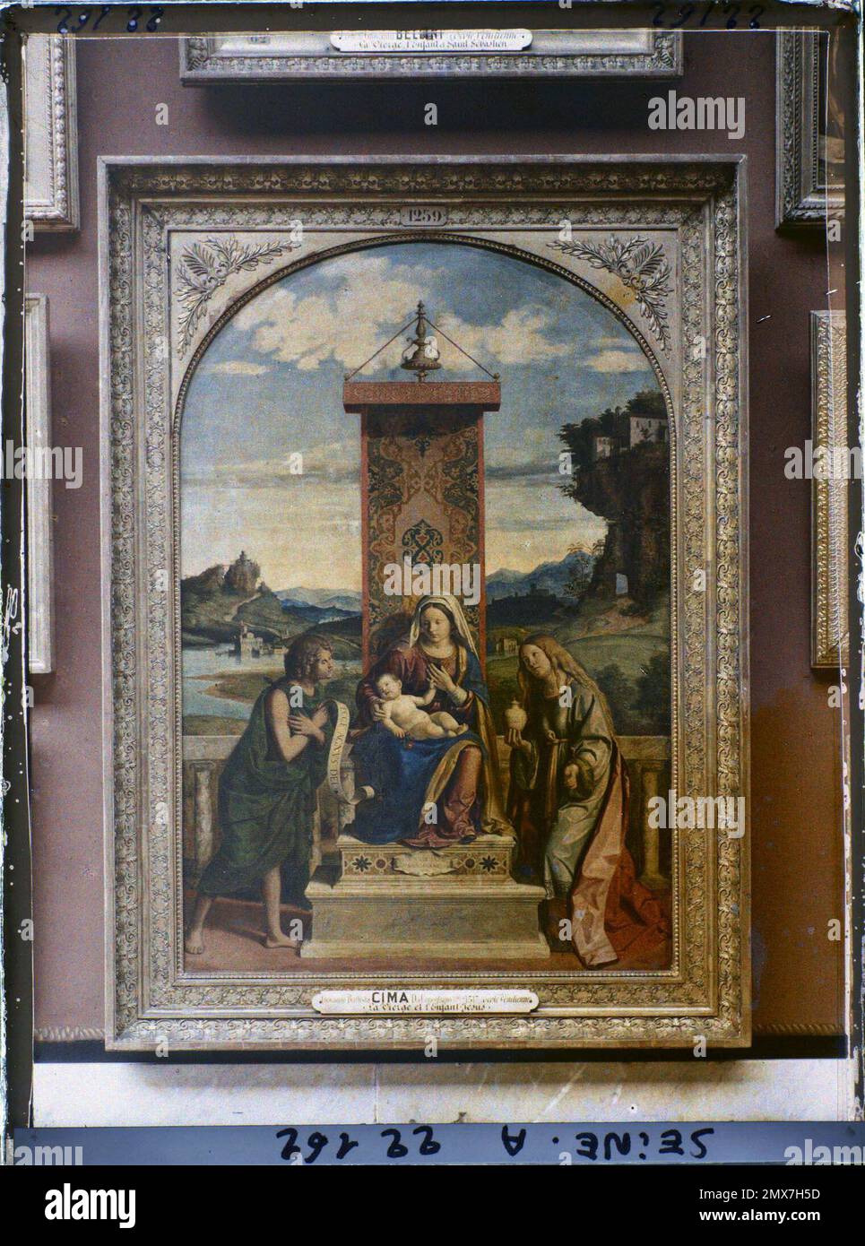 Paris (1st arr.), France The Virgin and the Child between Saint John the Baptist and Sainte Marie-Madeleine, Cima da Conegliano, Louvre museum , Stock Photo