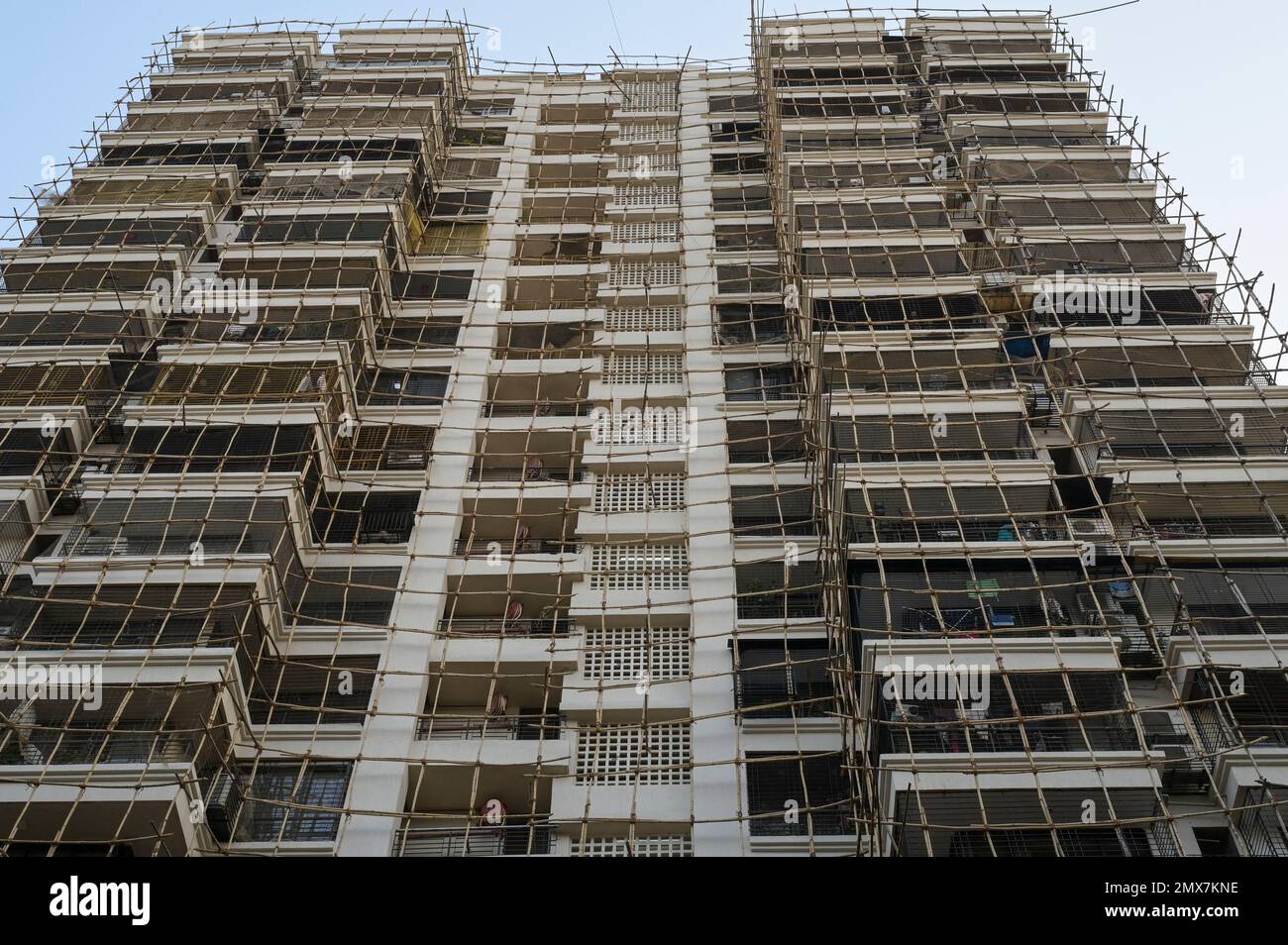 Picture of INDIA, Mumbai, apartment tower under renovation, Scaffolding with ...