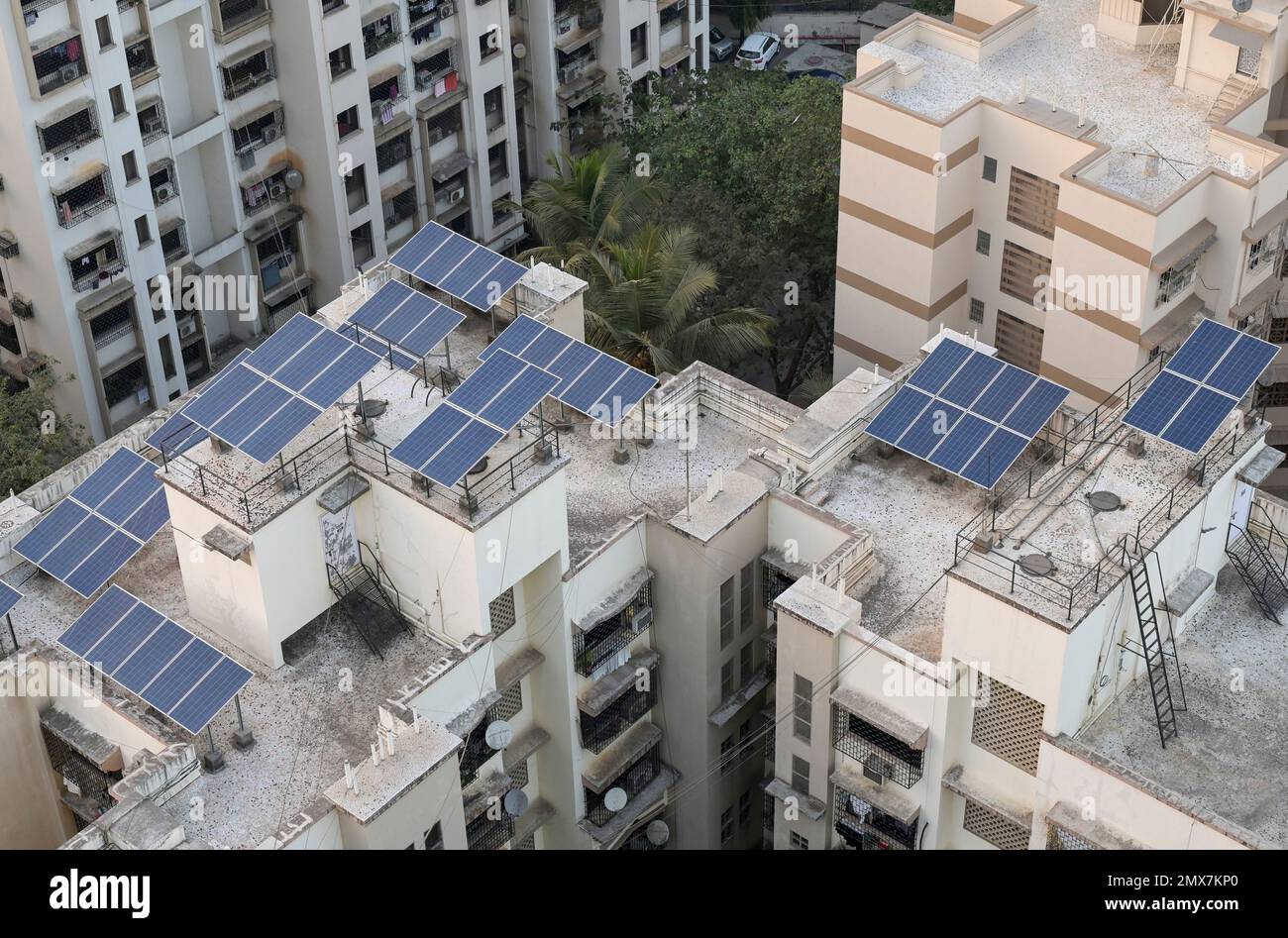 INDIA, Mumbai, skyscraper in suburb Goregoan, solar panel for power generation on roof / INDIEN, Mumbai, Stadtteil Goregoan, Hochhaeuser mit Solar Modulen zur Stromerzeugung auf dem Dach Stock Photo