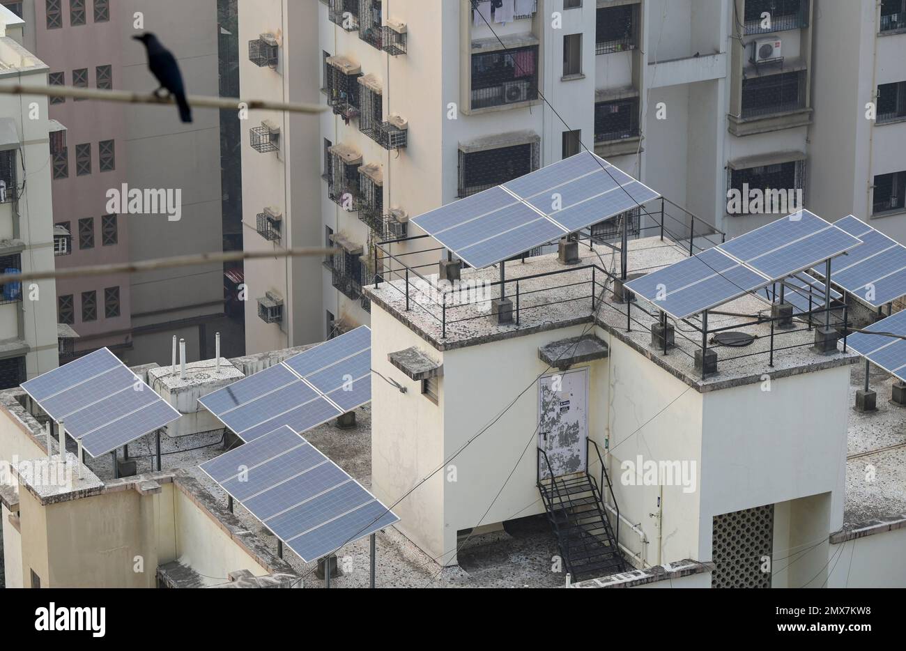 INDIA, Mumbai, skyscraper in suburb Goregoan, solar panel for power generation on roof / INDIEN, Mumbai, Stadtteil Goregoan, Hochhaeuser mit Solar Modulen zur Stromerzeugung auf dem Dach Stock Photo