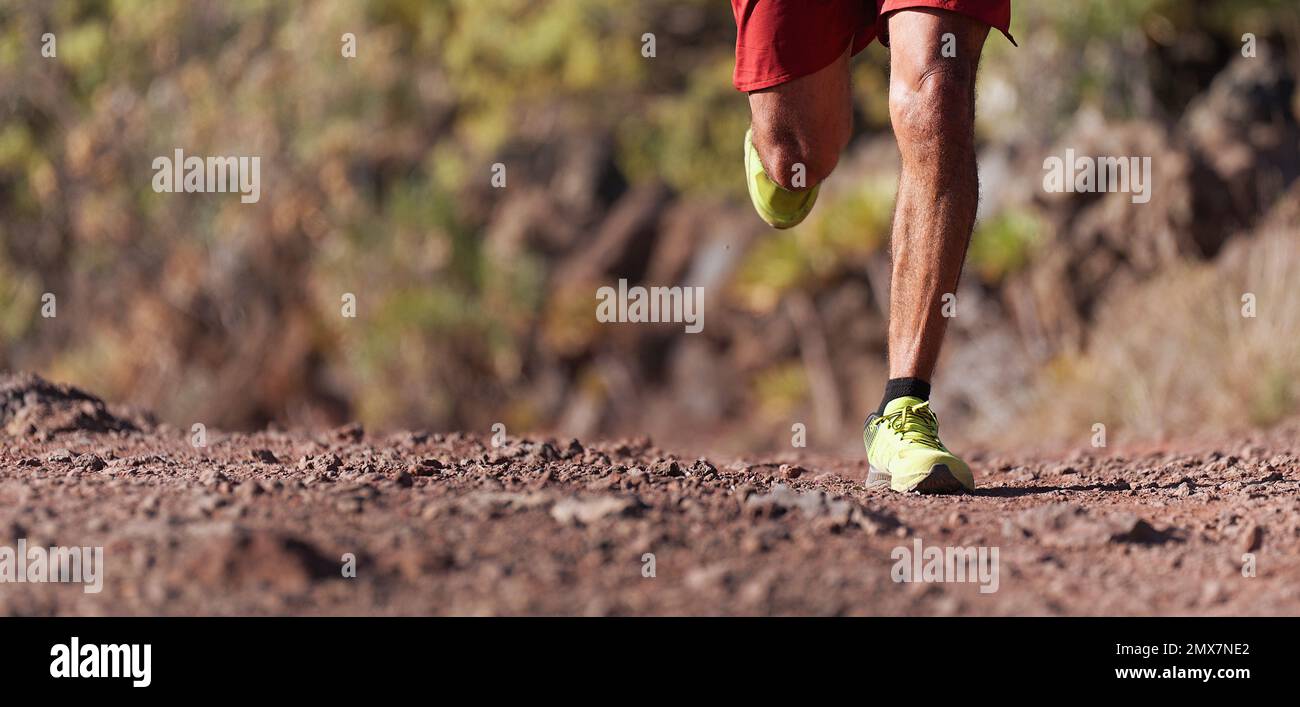 Trail running man on mountain path exercising Stock Photo - Alamy