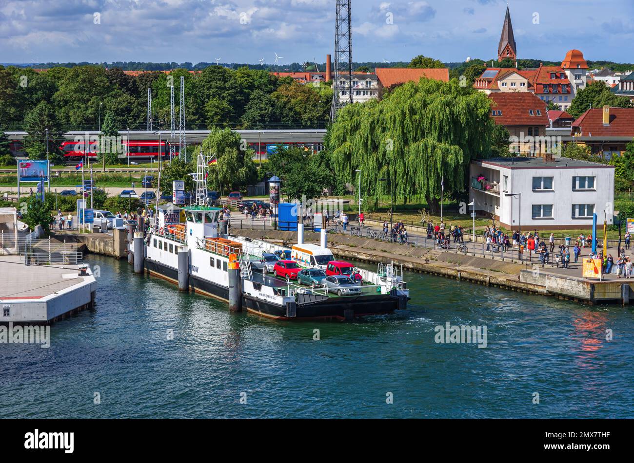 The car ferry "Warnow" fills up with vehicles and passengers on the