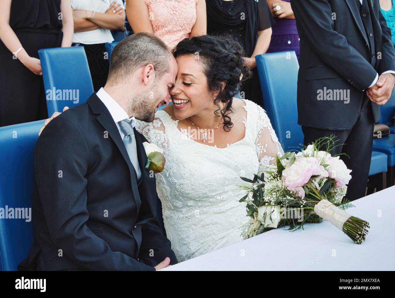 An attractive white caucasian couple getting married wearing formal dress Stock Photo