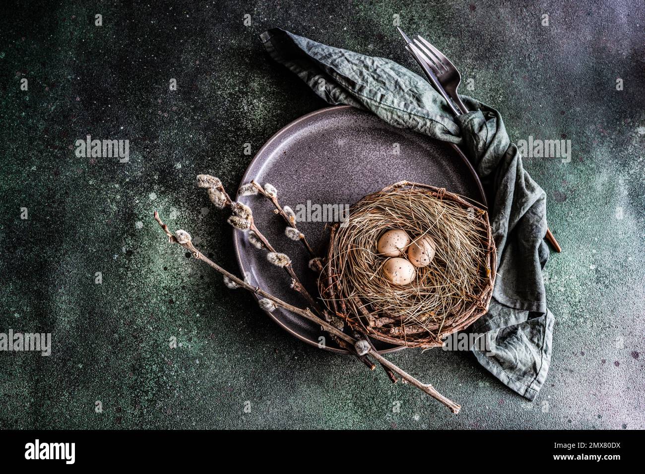 From above easter holiday dinner set with eggs on concrete table Stock Photo