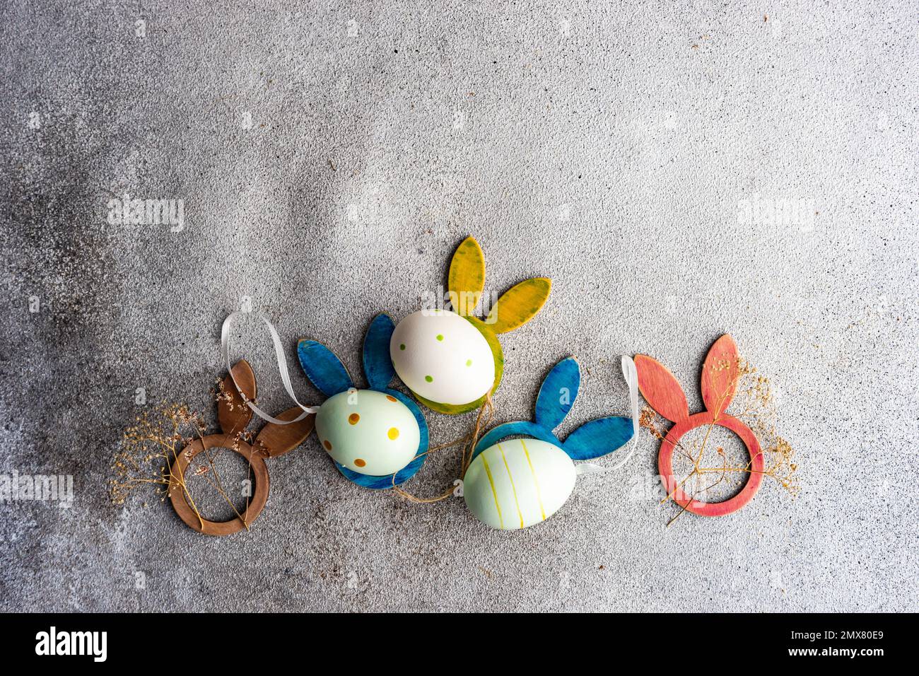 From above flat lay with eggs for Easter holiday concept on concrete background Stock Photo