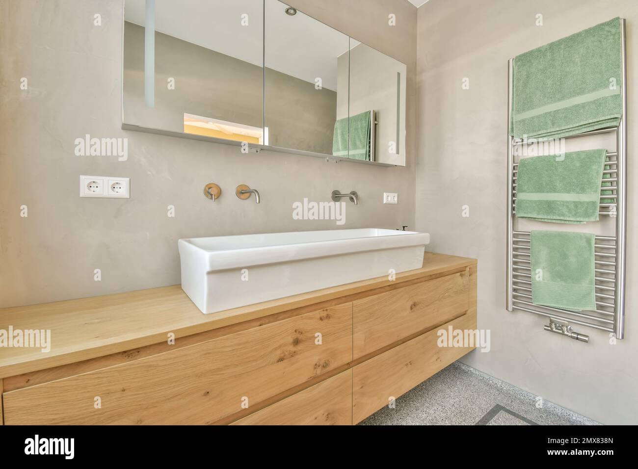 Contemporary bathroom interior design with mirror above big sink placed ...