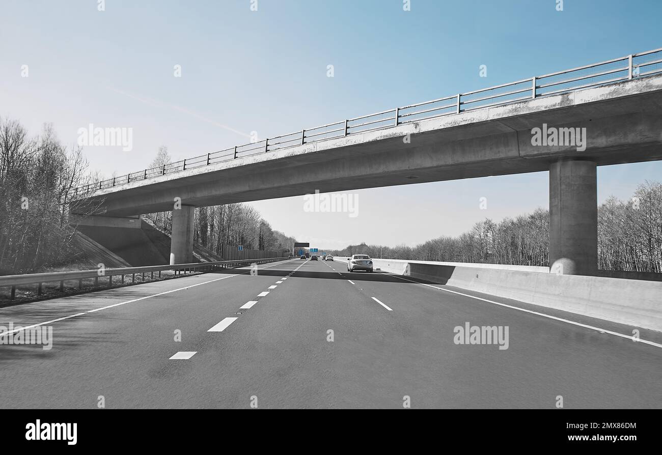Rear view of cars driving on motorway, Ireland. Road with metal safety ...