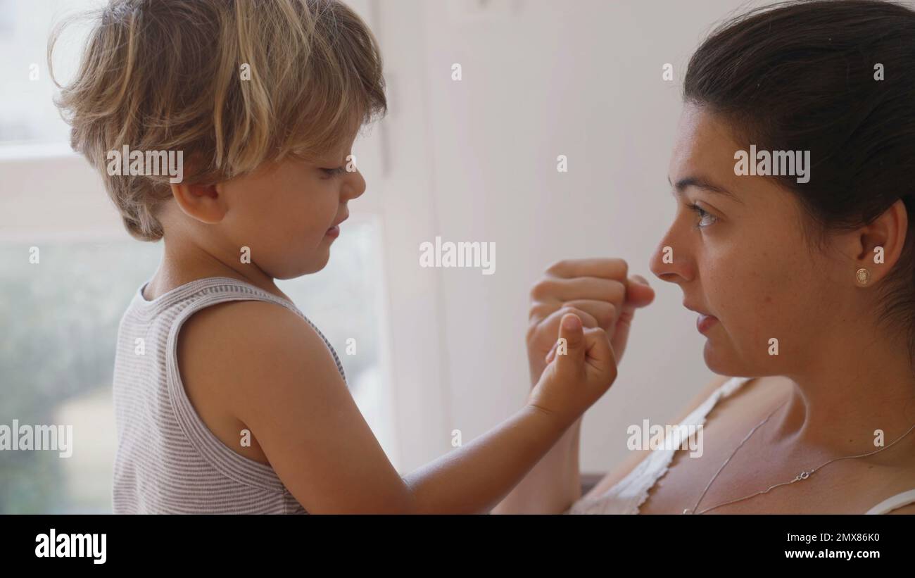Mother and son doing pinky swear. Parent and child promise. Mom and kid ...