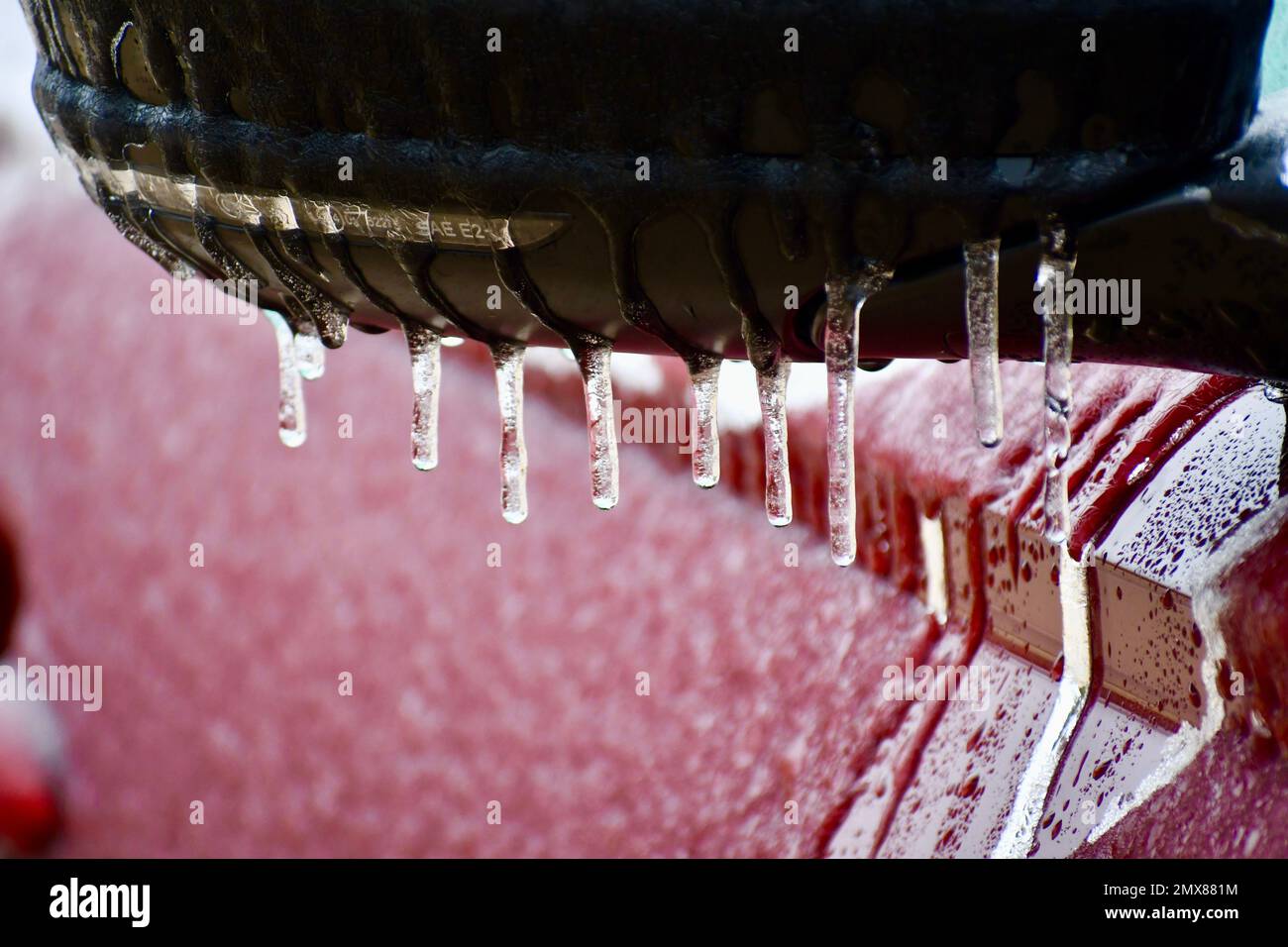 side view mirror on a red car covered in ice Stock Photo Alamy