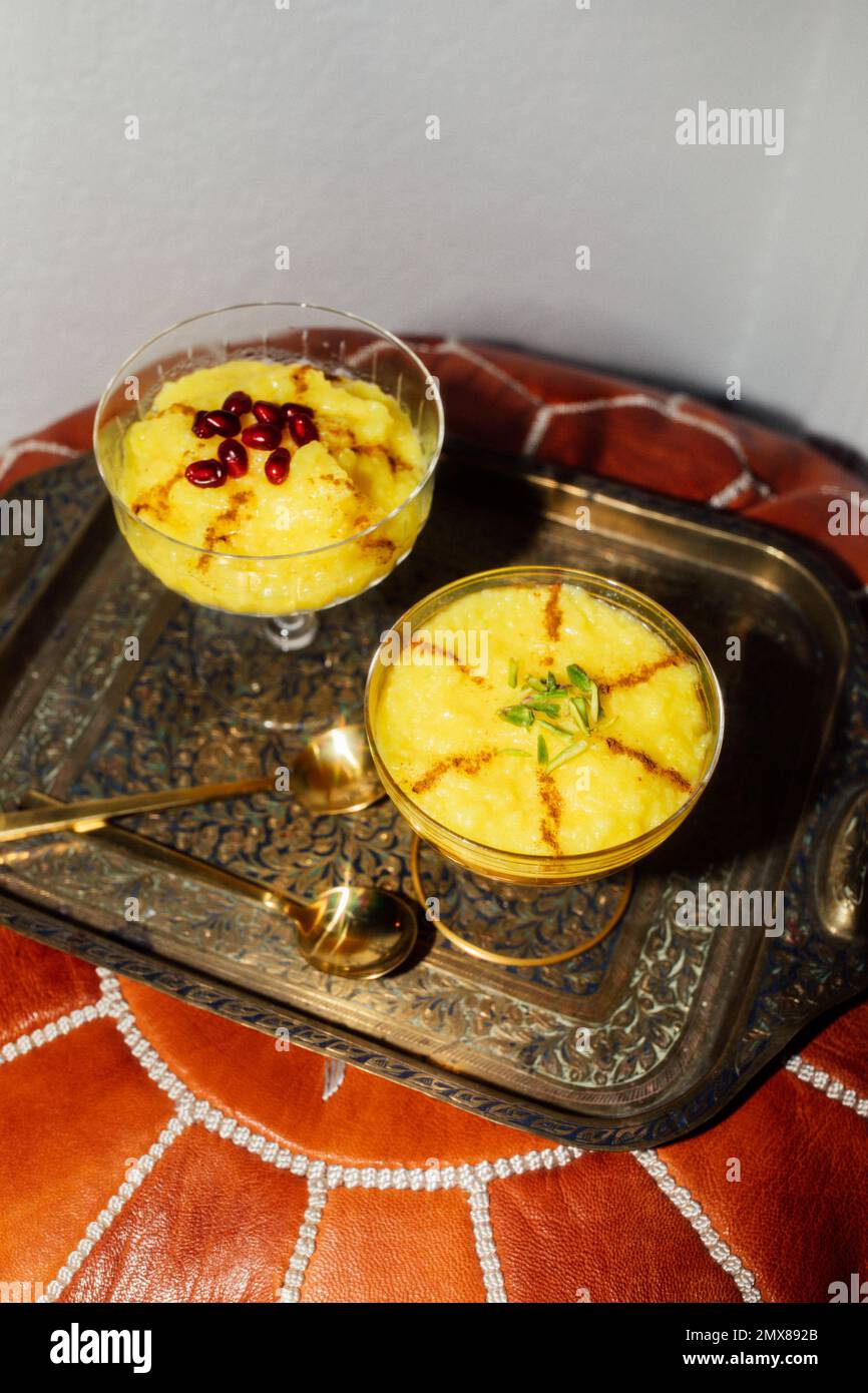two servings of Sholeh Zard, a Persian saffron rice pudding, dessert