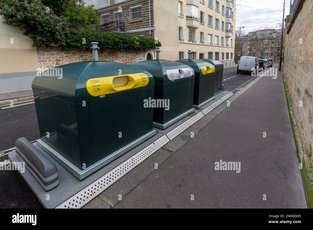 Waste recovery and sorting containers for recycling packaging and cardboard as well as glass objects in a street in Paris, France Stock Photo