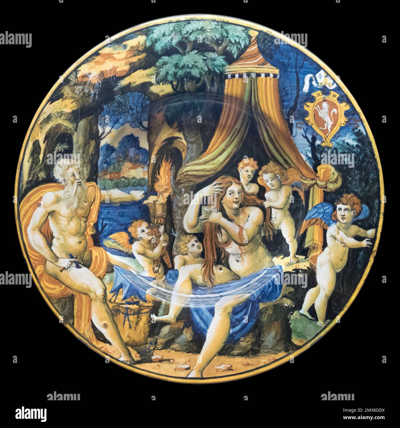 Majolica plate with Vulcan, Venus and cupids with the coat of arms of Bishop Giacomo Nordi (1535-1540), workshop of Guido Durantino. Stock Photo