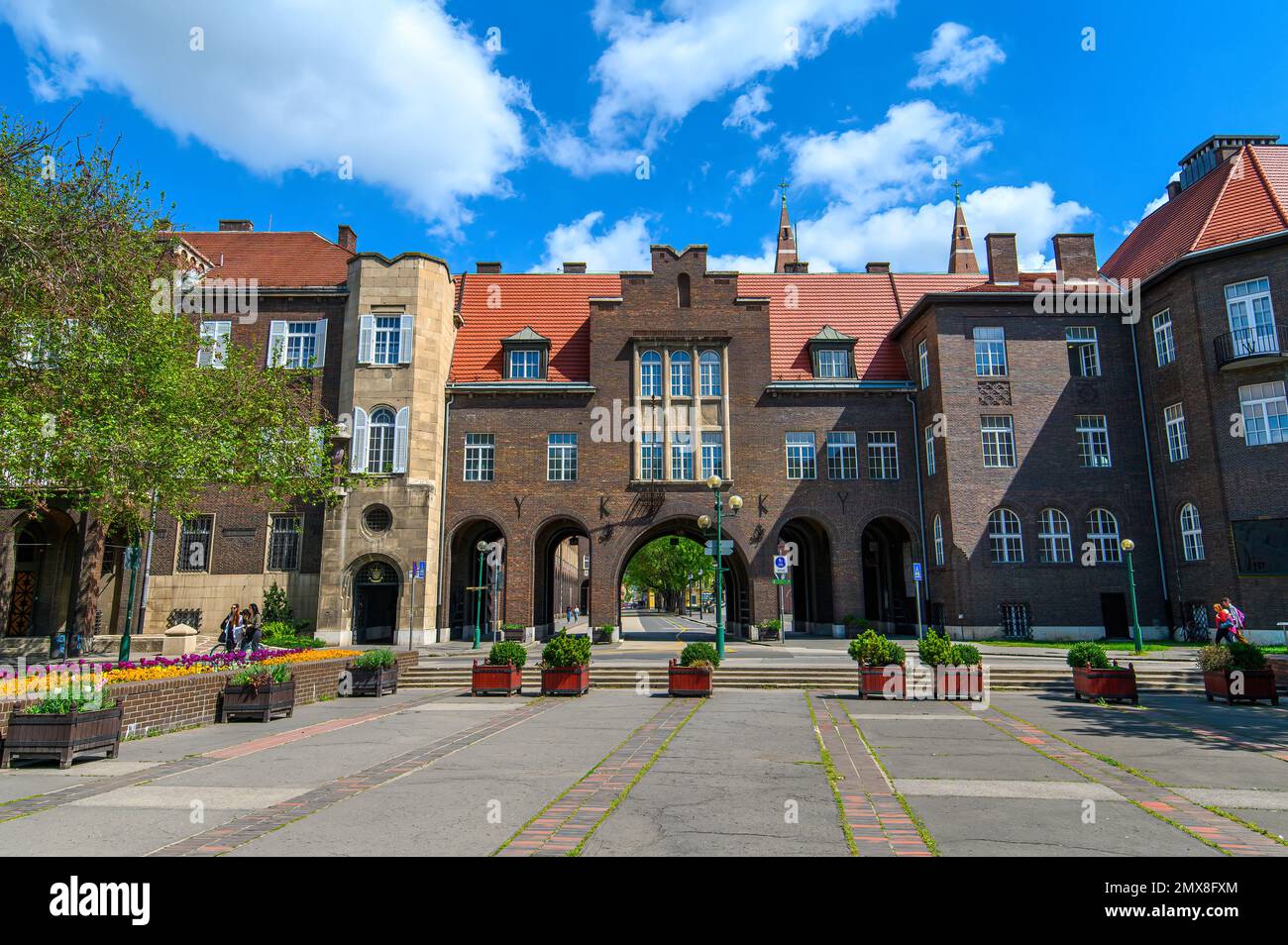 Szeged, Hungary. University of Dentistry named after Albert Szent-Gyorgyi next to Dom square and Votive Church Stock Photo