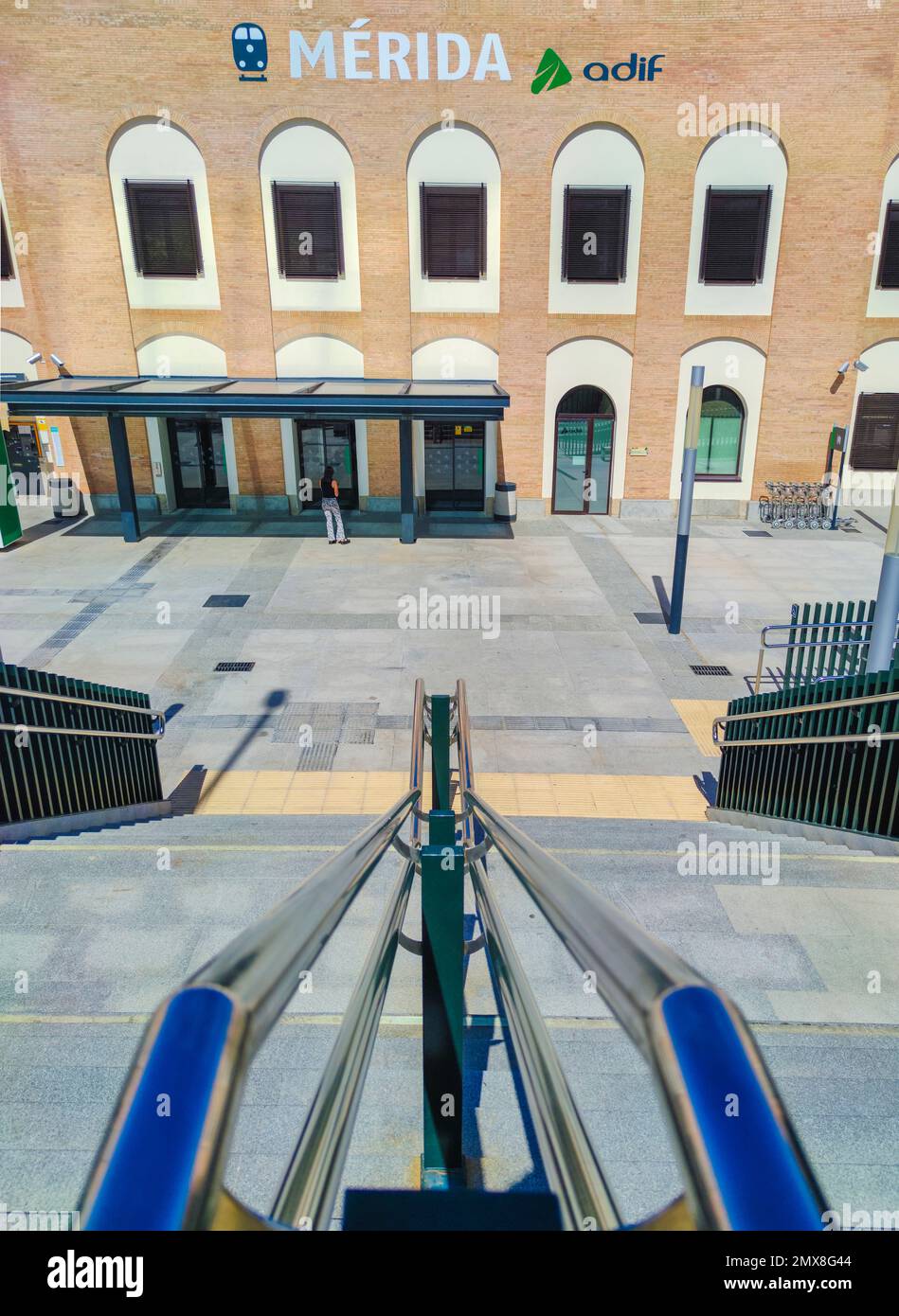 Merida, Spain - Setp 18th, 2021: Merida train station stairs access. Chrome handrails Stock Photo