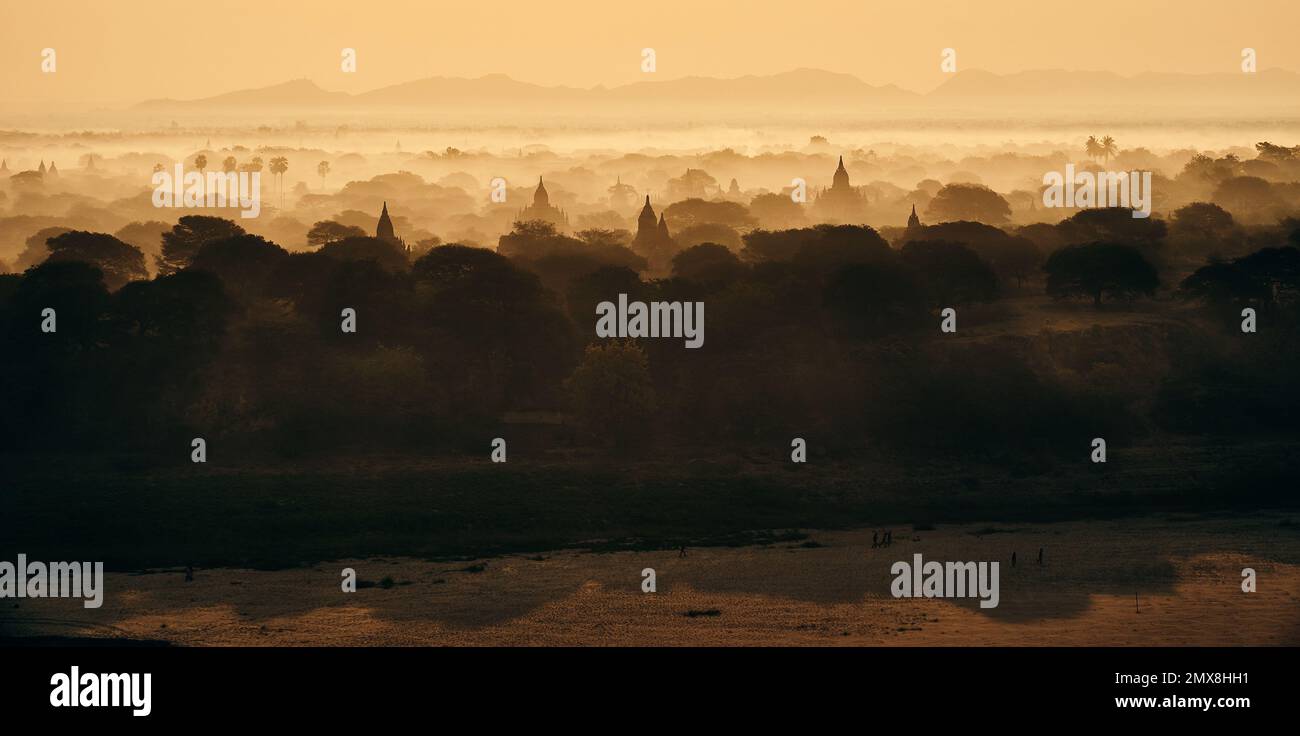 Aerial view of Burmese temples at sunrise on a foggy morning in Bagan, Myanmar (Burma). Stock Photo
