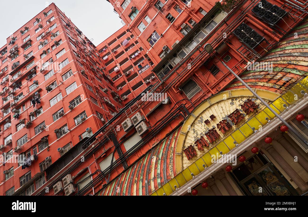 Low angle view of an old apartment building towering above the street