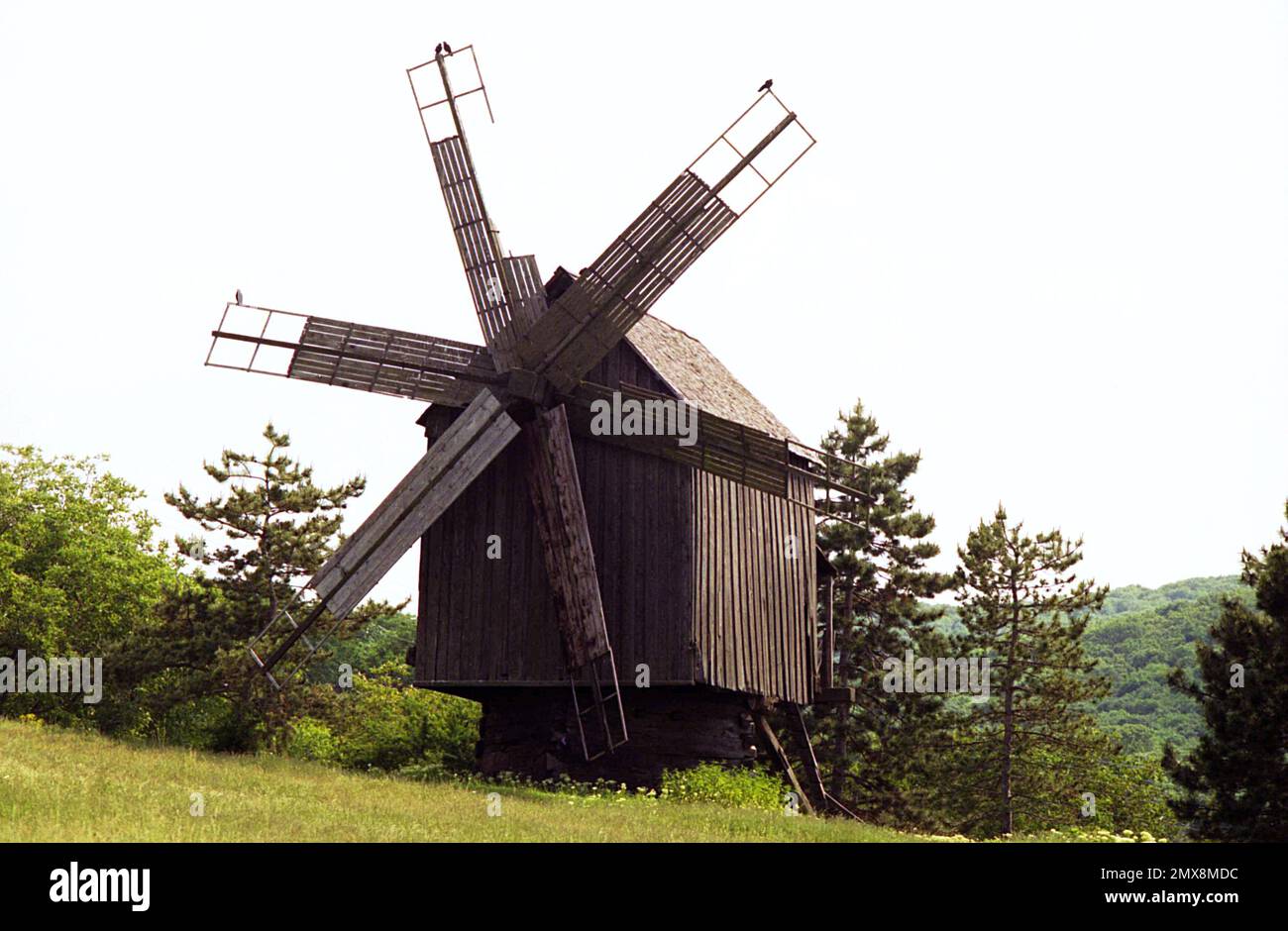 Tulcea County, Dobrogea, Romania, approx. 2000. The windmill on the grounds of Celic Dere Monastery. Used as a gristmill, is a historical monument built at the beginning of the 20th century. Stock Photo