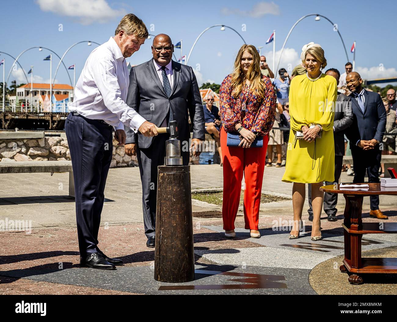 WILLEMSTAD - King Willem-Alexander strikes a euro coin on Curacao in the  presence of Queen Maxima and Princess Amalia. The Crown Princess has a  two-week introduction to the countries of Aruba, Curacao