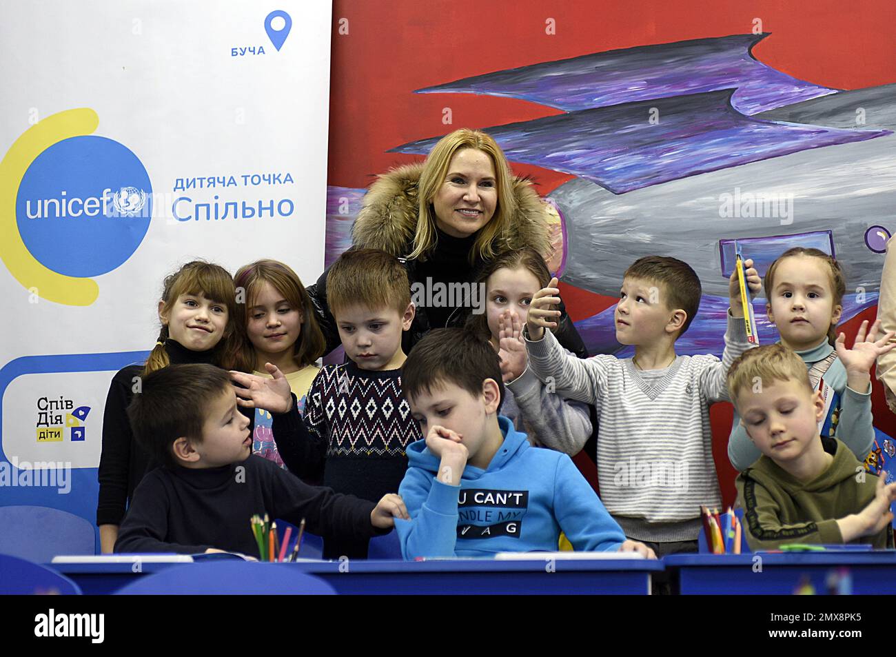 Non Exclusive: BUCHA, UKRAINE - FEBRUARY 2, 2023 - Deputy Speaker of the Verkhovna Rada of Ukraine Olena Kondratiuk poses for a photo with children at Stock Photo