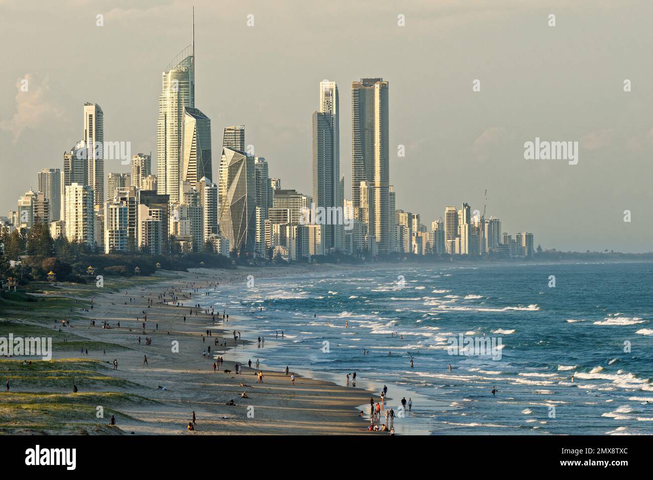 Landscape of Gold Coast, city next to Brisbane in Australia, evening or morning sun on the beach, blue ocean with waves and skyscrapers. Australian ho Stock Photo