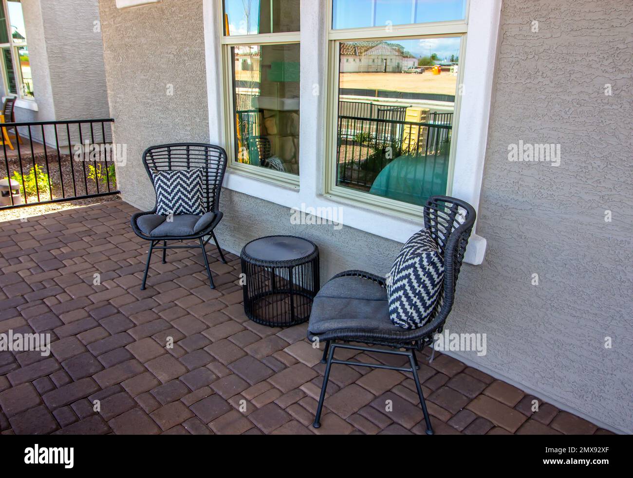 Pavers Front Porch With Two Chairs And Table Stock Photo - Alamy