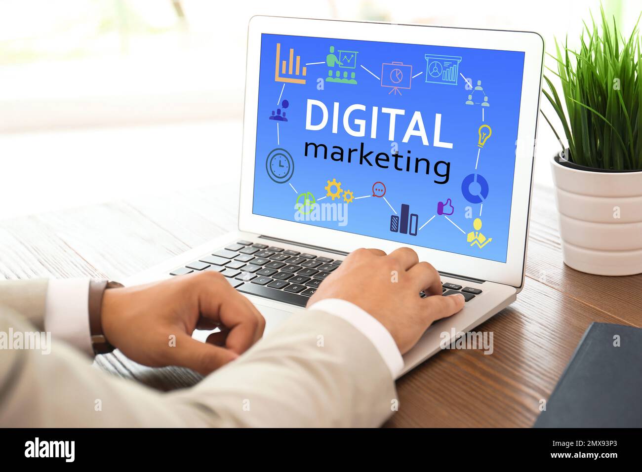 Digital marketing concept. Man using modern laptop at table Stock Photo ...