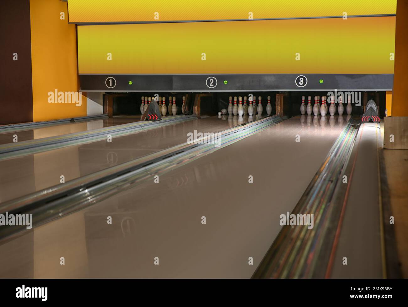 Bowling alley lanes with pins in club Stock Photo Alamy