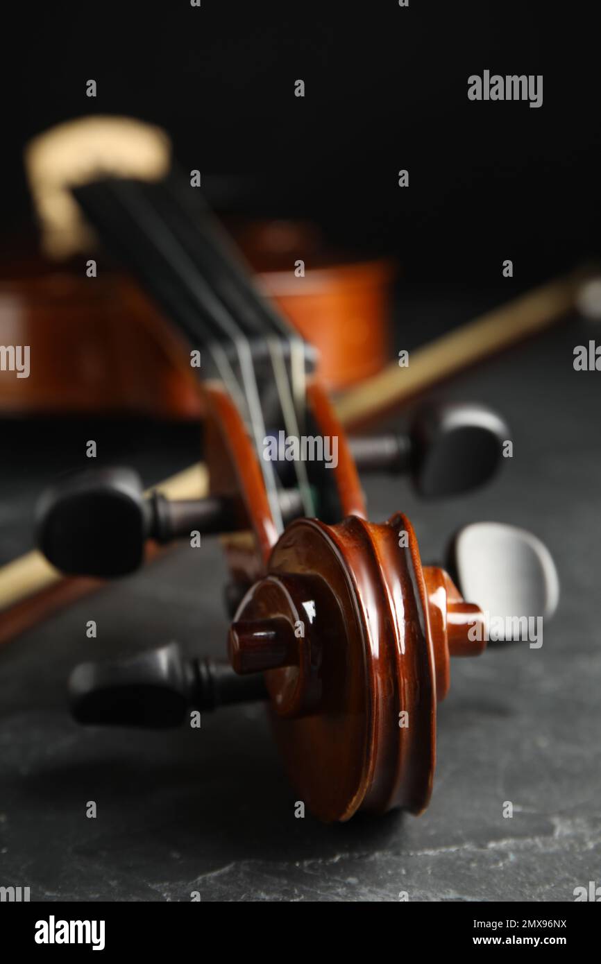 Classic violin and bow on grey stone table, closeup Stock Photo