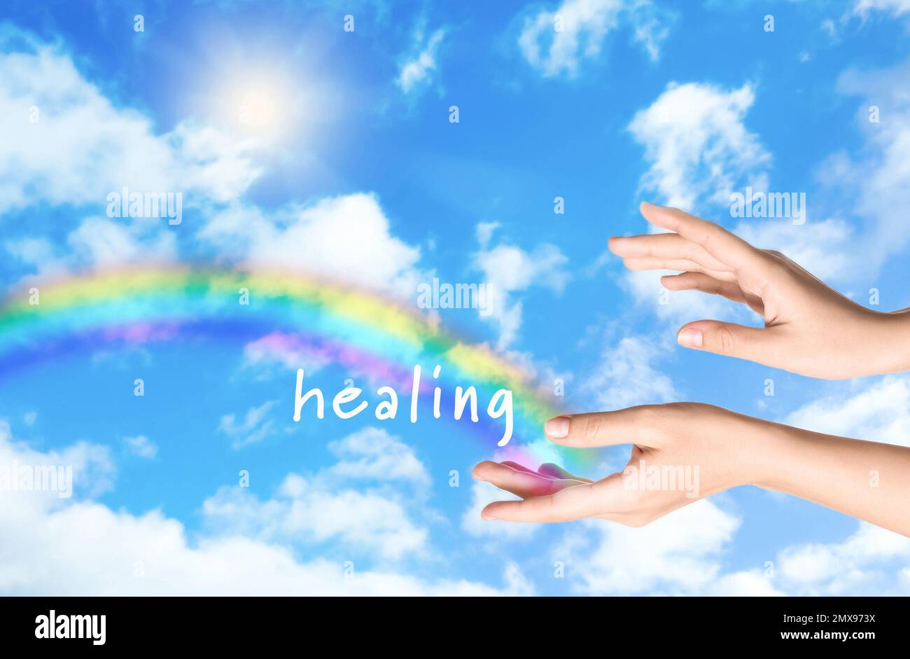 Woman and rainbow as source of healing energy on sunny day, closeup Stock Photo