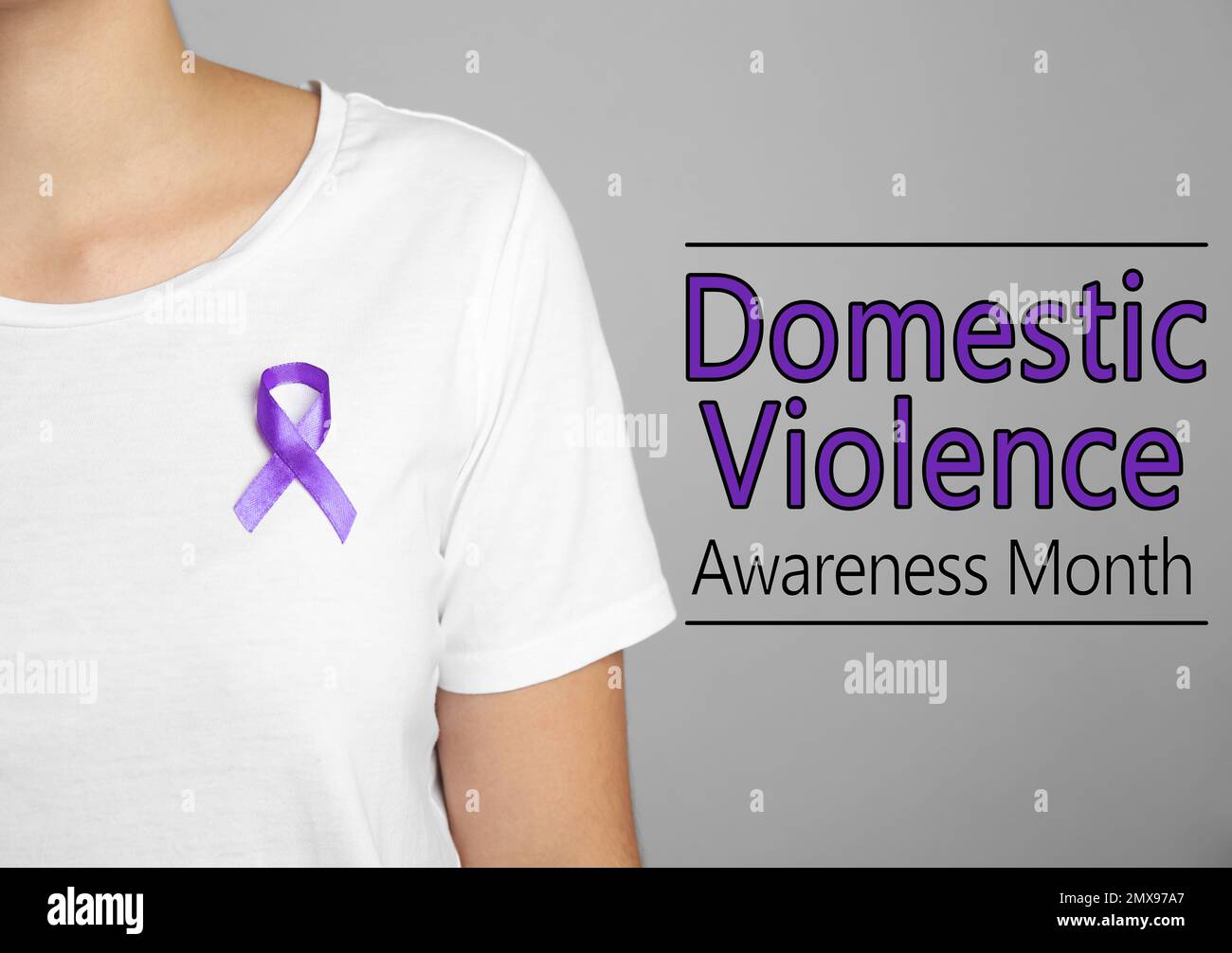 Woman with purple ribbon on grey background, closeup. Symbol of Domestic Violence Awareness Stock Photo
