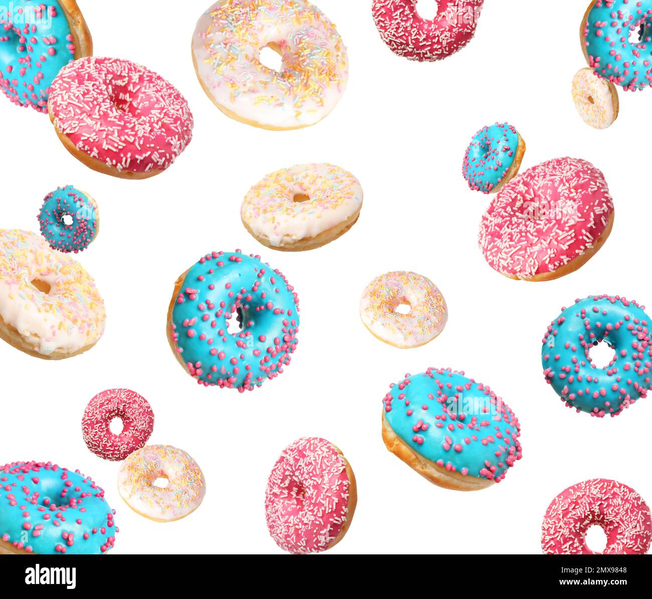Set of falling delicious donuts on white background Stock Photo - Alamy