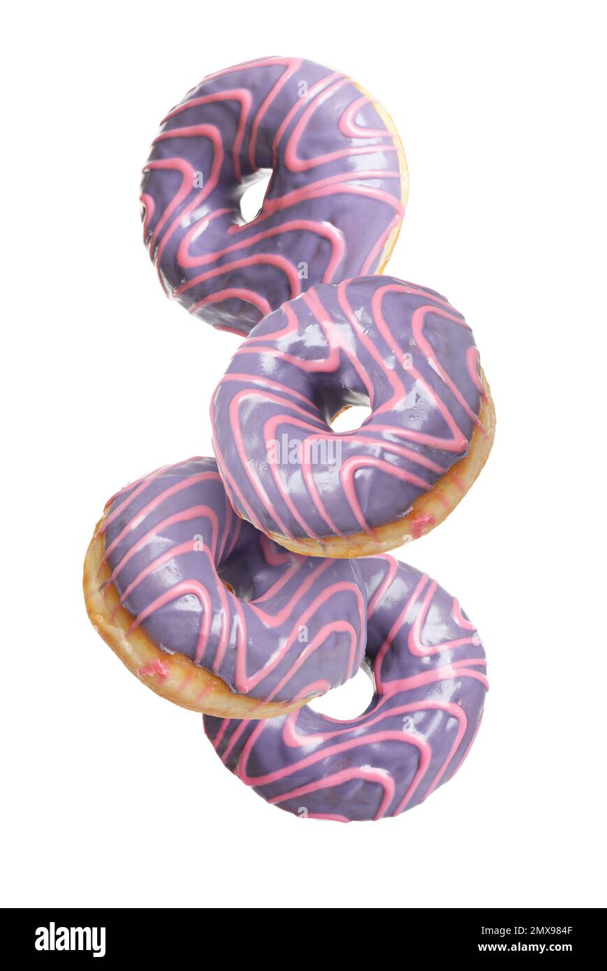 Set of falling delicious donuts on white background Stock Photo - Alamy