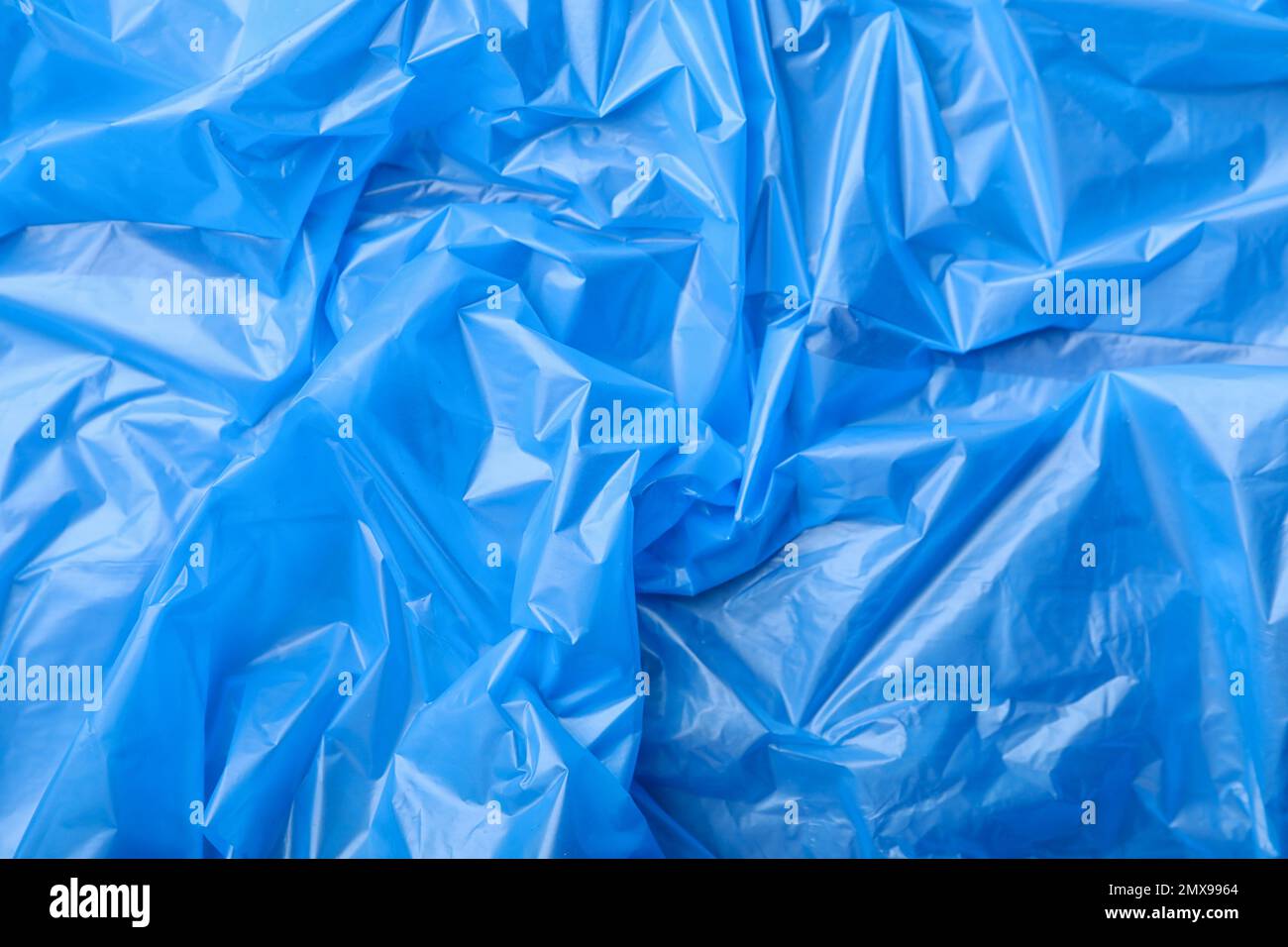 Crumpled blue polyethylene as background Stock Photo