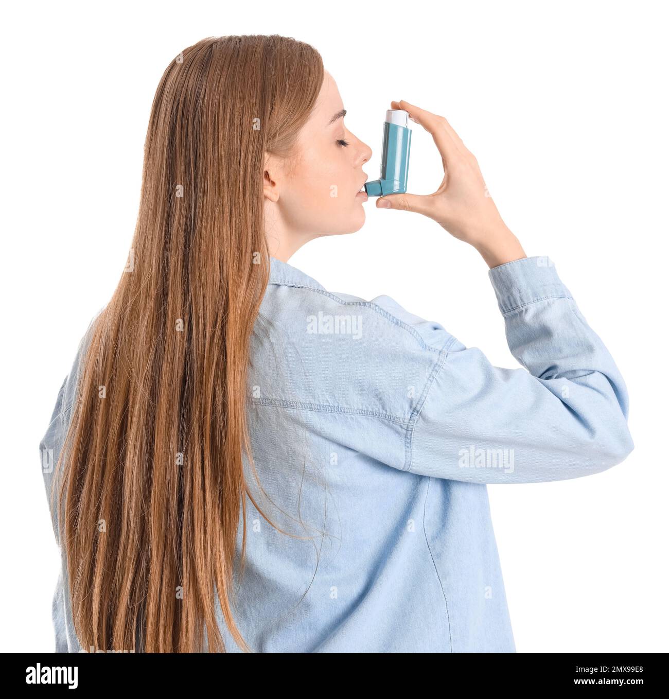 Young woman with inhaler on white background Stock Photo - Alamy