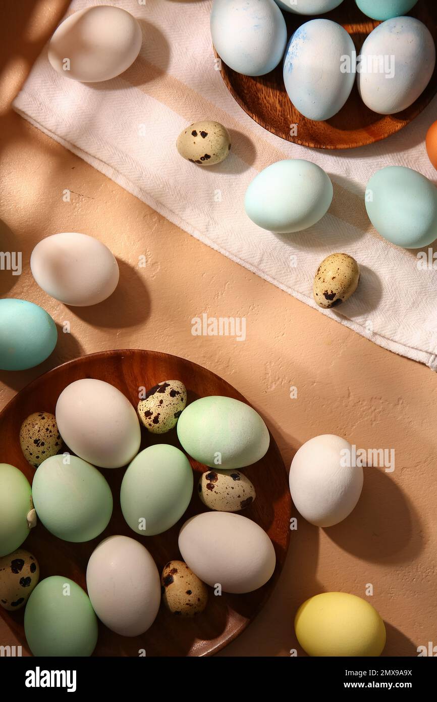 Composition with beautiful painted and natural Easter eggs on color background Stock Photo
