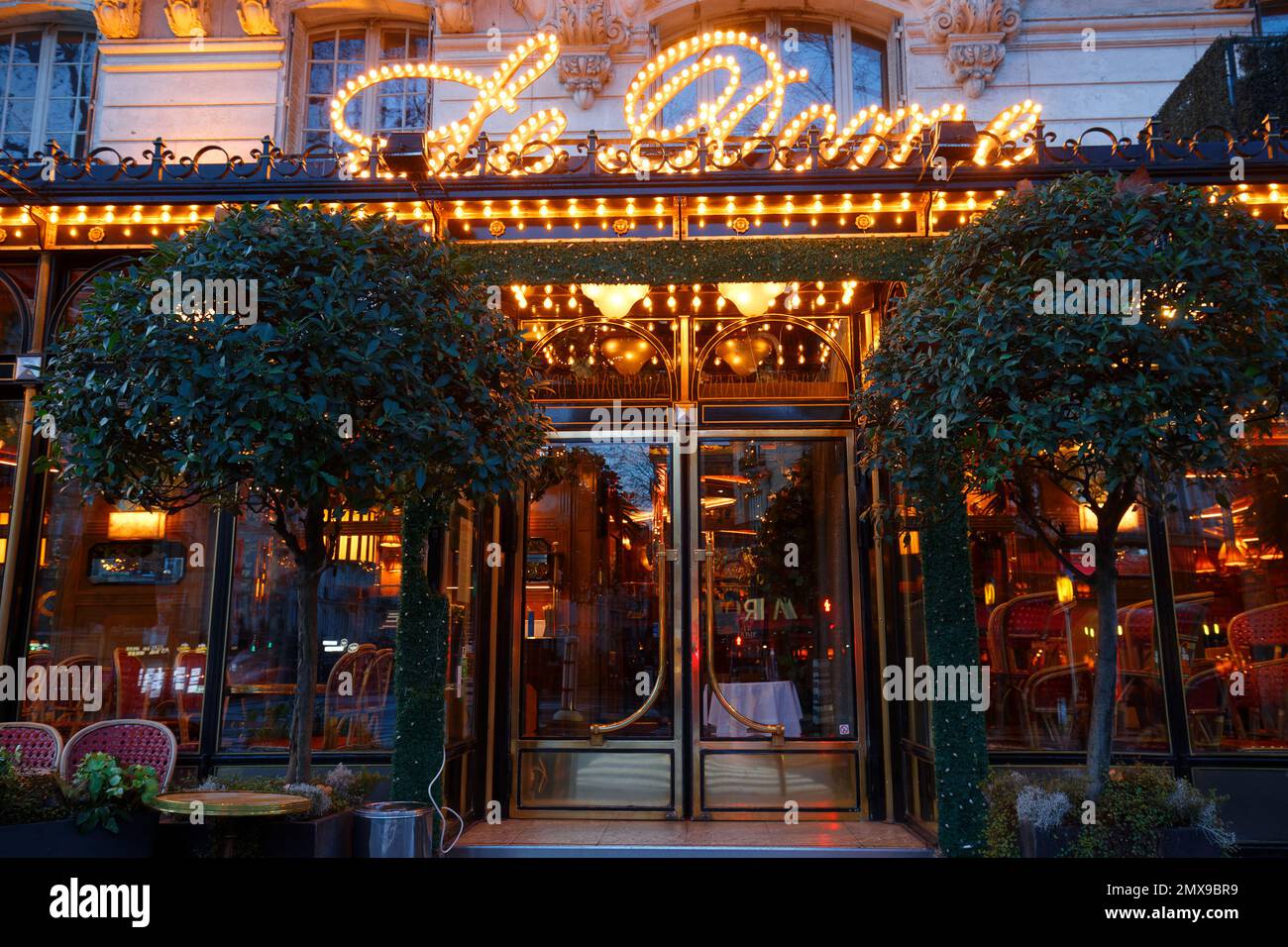 The famous restaurant Le Dome at night. It located on Montparnasse boulevard in Paris. Stock Photo