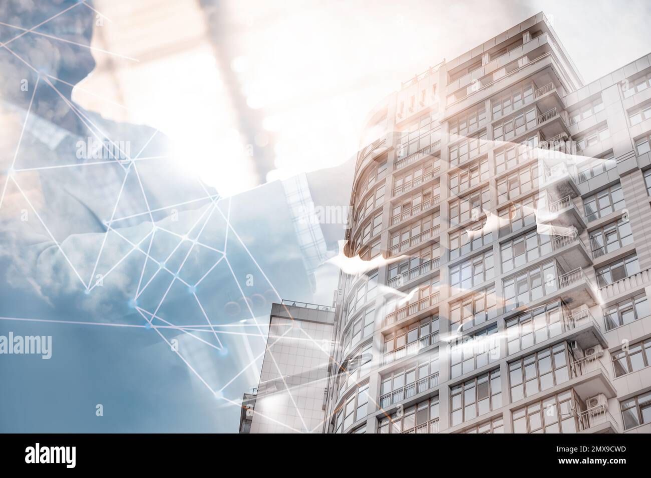 Business people shaking hands and modern building, closeup. Double ...