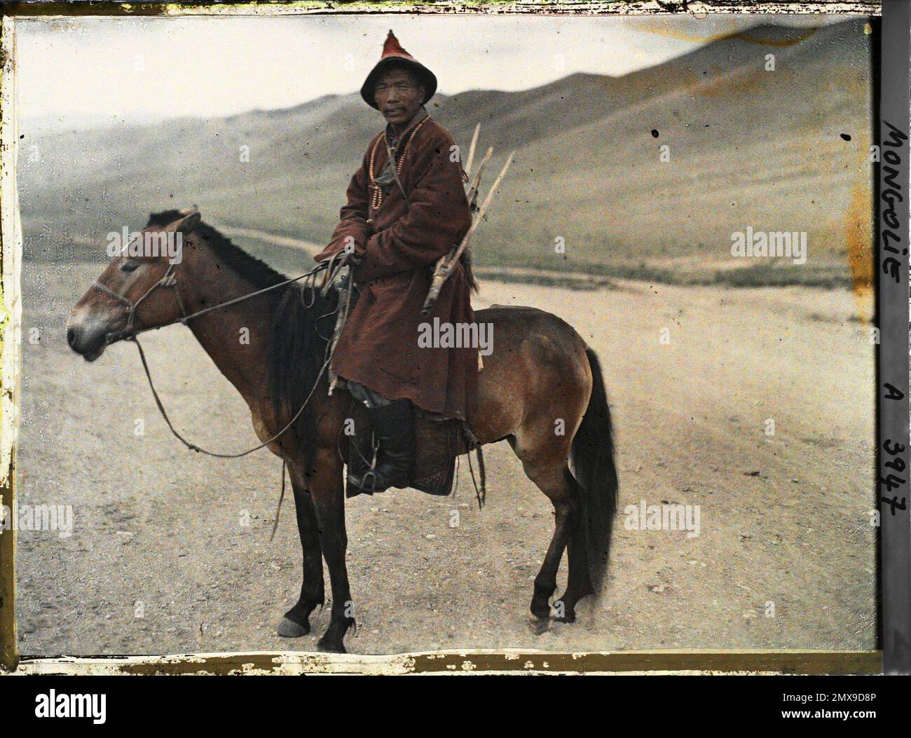 Around Ourga, Mongolia a Mongolian hunter on horseback and armed with a stone rifle , 1913
