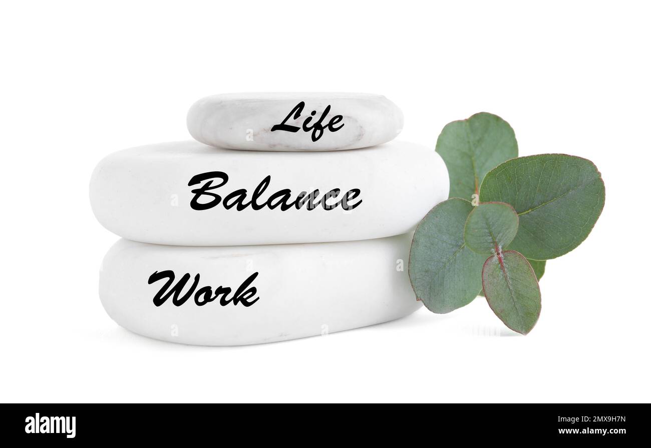 Work-life balance concept. Stacked stones and eucalyptus on white background Stock Photo
