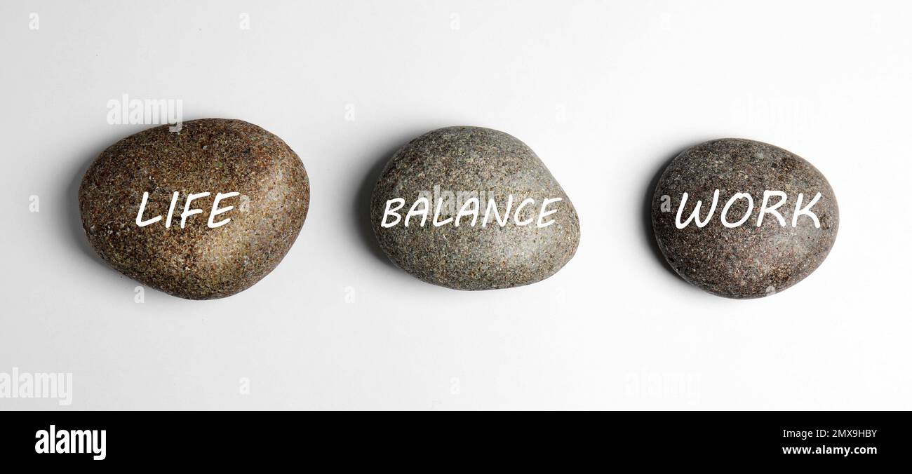 Work-life balance concept. Stones on white background, top view Stock ...