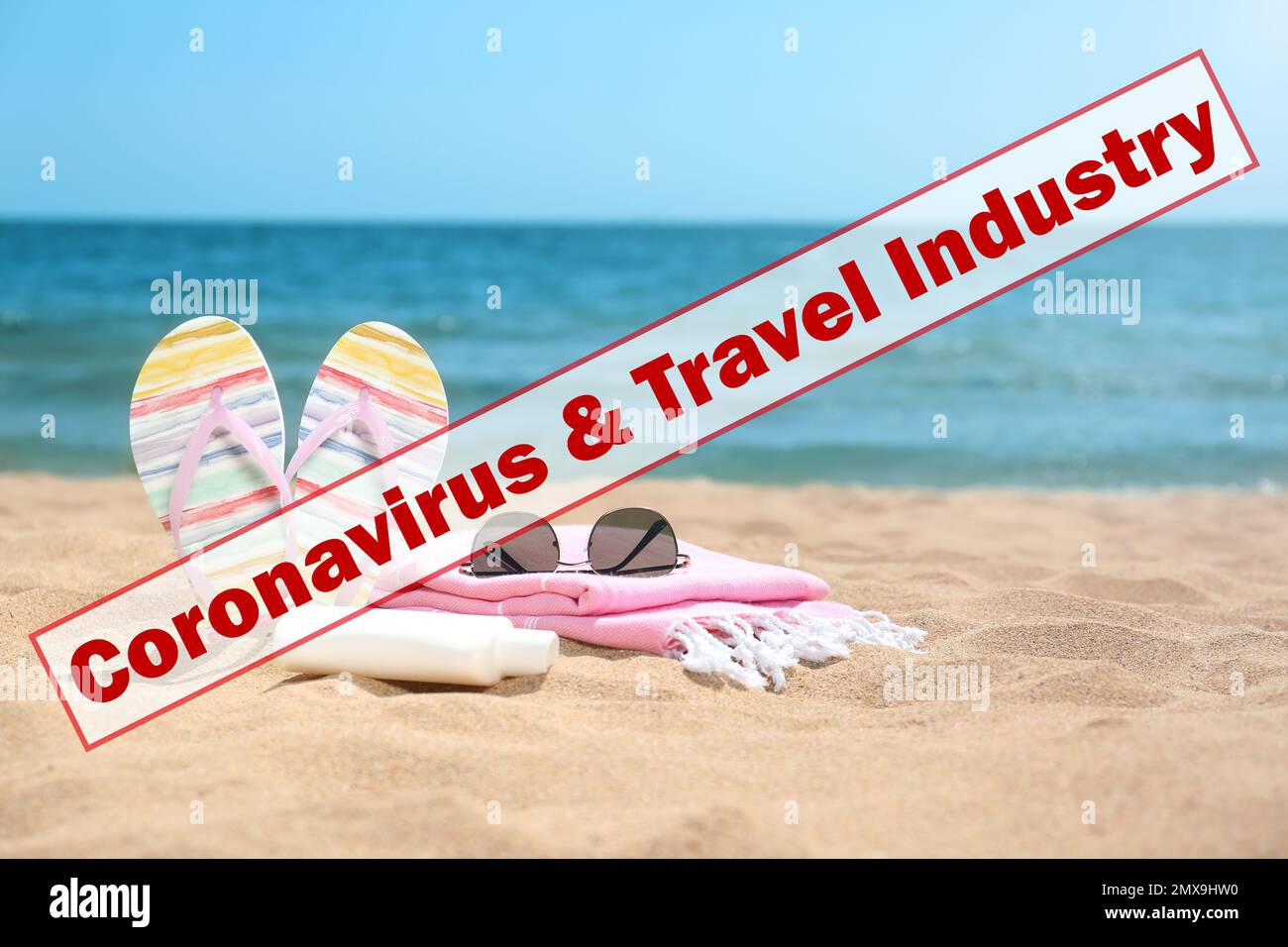 Vacation cancellation concept. Different beach objects on sand near sea Stock Photo