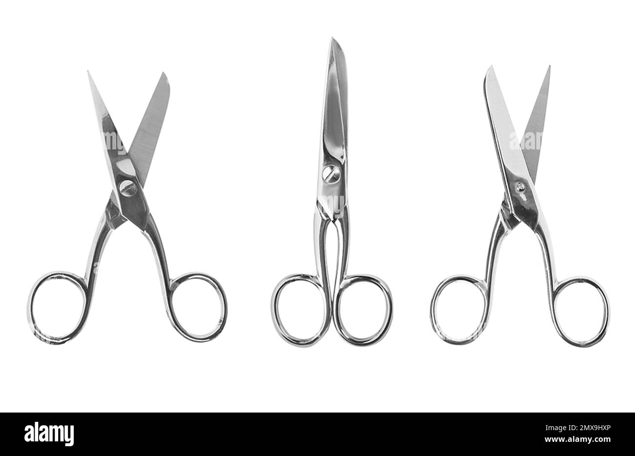 Set of sharp sewing scissors on white background, top view Stock Photo
