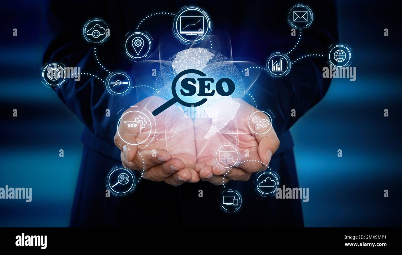 Man demonstrating directions of SEO. Icons of keyword research, customization and others Stock Photo