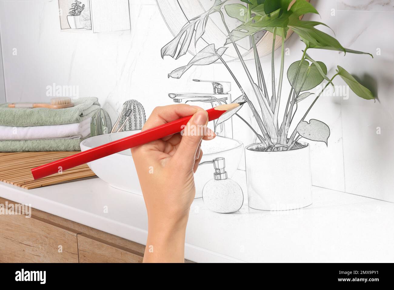 Woman drawing bathroom interior design. Combination of photo and sketch Stock Photo
